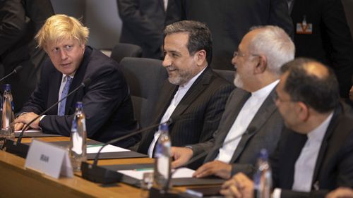 British Foreign Secretary Boris Johnson, left, talks, during a meeting of the foreign ministers from Britain, France and Germany with the Iran Foreign Minister Javad Zarif and EU foreign policy chief Federica Mogherini. (AAP)