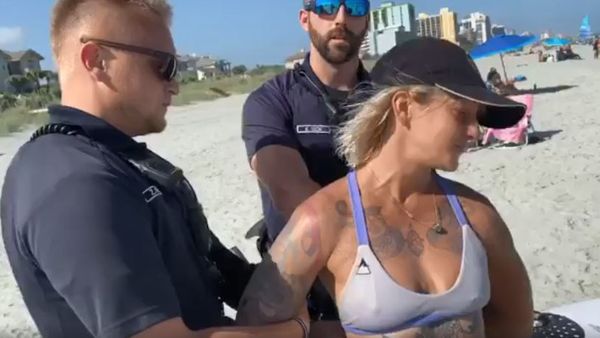 Woman handcuffed by police for wearing 'thong' swimsuit