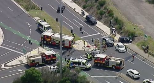 Emergency services swarm the scene of the four-car smash.