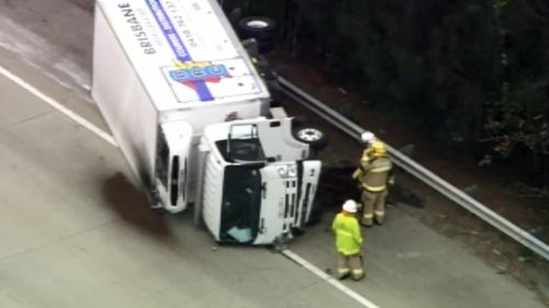 A truck and police car crashed on the Pacific Motorway. (9NEWS)