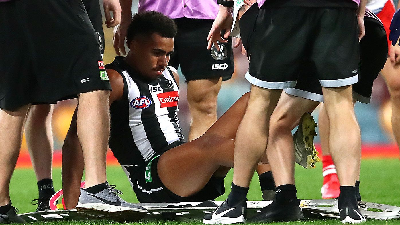 AFL boss responds to boot stud investigation after Magpies star's shin split 'six or eight inches open'
