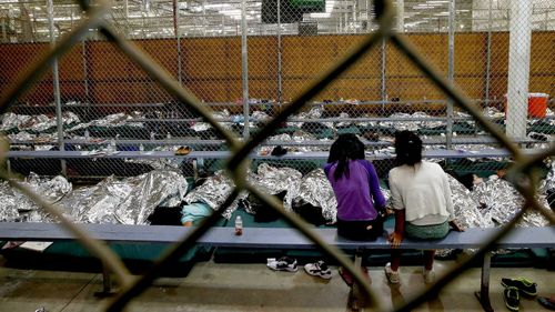 Children huddle together inside one of many camps where separated children are being held. (AP)