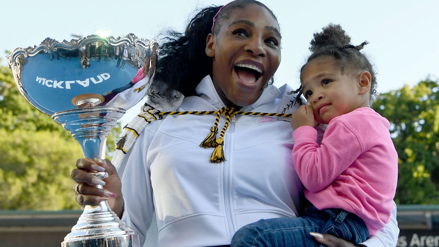 Serena Williams of the USA celebrates with daughter Alexis Olympia after winning the final match against Jessica Pegula