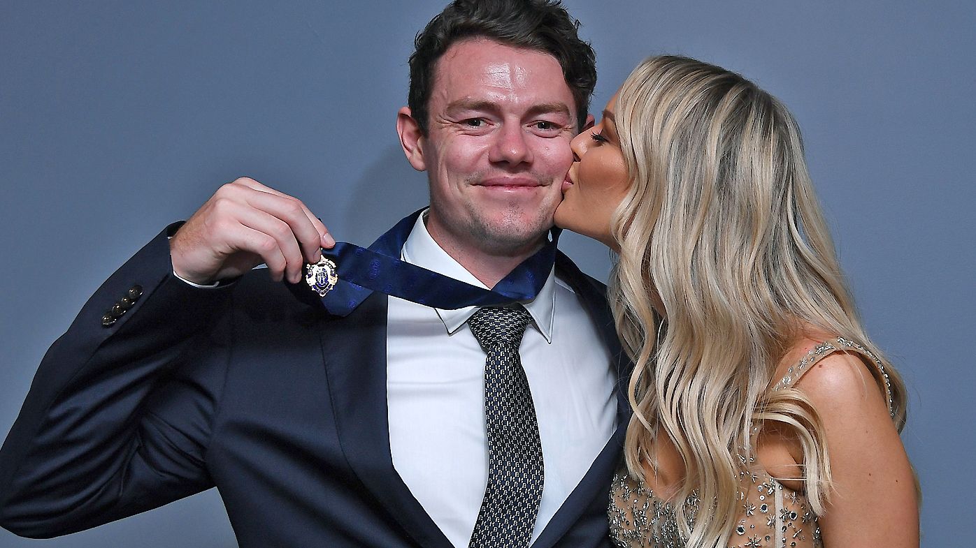  Lachie Neale of the Lions poses with his wife Julie Neale after winning the Brownlow Medal 
