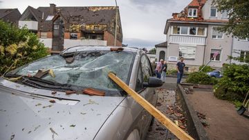 A damaged car is seen after a storm in Paderborn, Germany, Friday, May 20, 2022.  