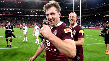Cameron Munster and Daly Cherry-Evans celebrate victory over arch rivals New South Wales.