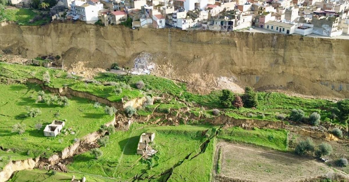 Aerial images capture properties hanging off cliffside after landslide in Italy