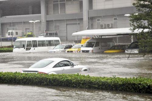 Water of high waves due to Tyhoon Jebi covers a parking area at Kansai International Airport in Osaka Prefecture