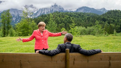 German Chancellor Angela Merkel speaks with US President Barack Obama at Schloss Elmau hotel in Germany. (Michael Kappeler/AP)