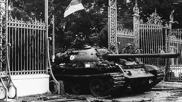 A North Vietnamese communist tank driving through the main gate of the presidential palace of the US-backed South Vietnam regime as the city falls into the hands of communist troops in 1975. (Getty Images)
