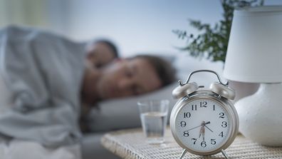 Couple asleep in a clean bedroom