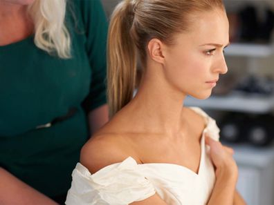 Uptight bride getting ready for wedding