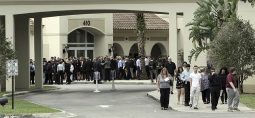 Mourners leave the Church by the Glades in Coral Springs after funeral services for Luke Hoyer. (AAP)