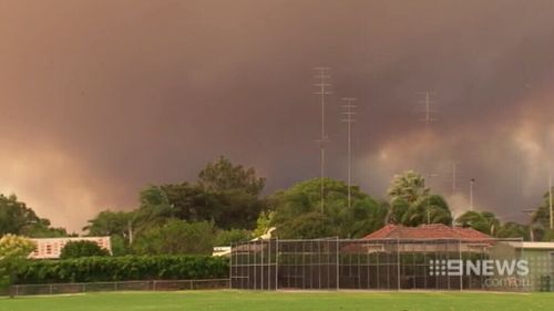 The fire looms over Harvey. (9NEWS)