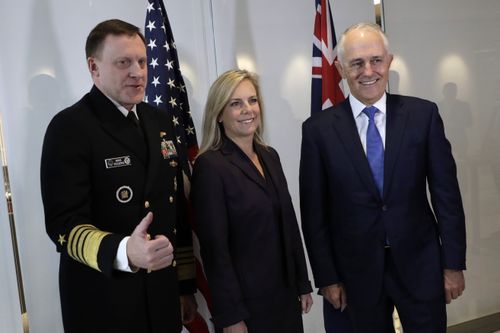 Mr Turnbull poses for a photo with with Homeland Security Secretary Kirstjen Nielsen and National Security Agency director Michael Rogers. (AAP)
