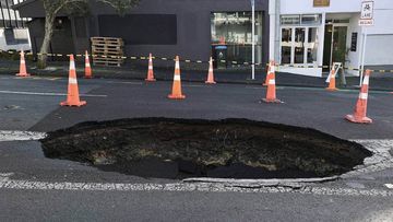 A sinkhole has opened on an Auckland street.