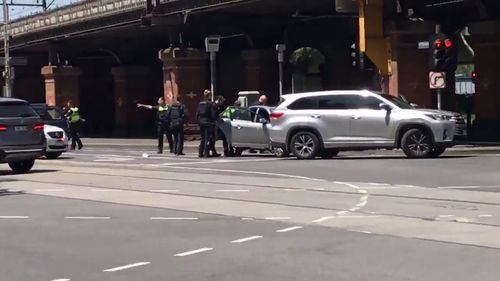 Officers appeared to focus their attention on a silver sedan.