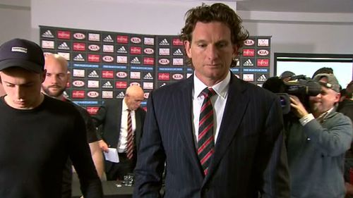 Hird leaving the Tullamarine media conference where he confirmed his resignation as coach. (9NEWS)