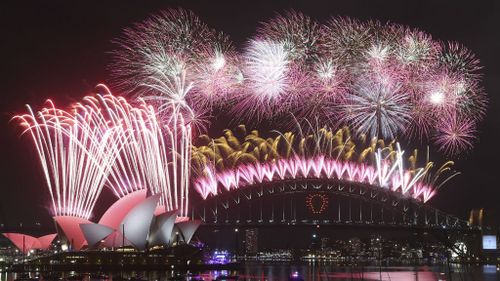 Fireworks light up the sky above Sydney Harbour. (AAP)