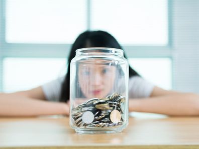 Woman with money jar