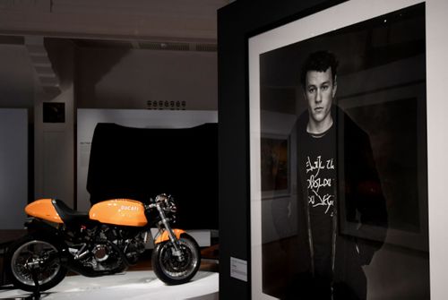 A portrait and the personal motorbike of the late Australian actor Heath Ledger featured in the exhibition.