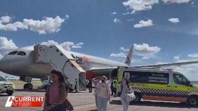 The Jetstar flight was diverted to Alice Springs because another passenger needed medical attention.