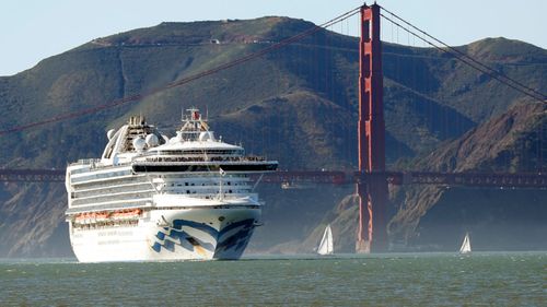 In this Feb. 11, 2020 photo, the Grand Princess cruise ship passes the Golden Gate Bridge as it arrives from Hawaii in San Francisco. California's first coronavirus fatality is an elderly patient who apparently contracted the illness on a cruise, US authorities said Wednesday, March 4.
