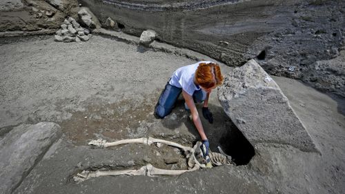 The skeleton, found facing face-up, appears to have been crushed by a large stone during the catastrophe. Picture: AAP.