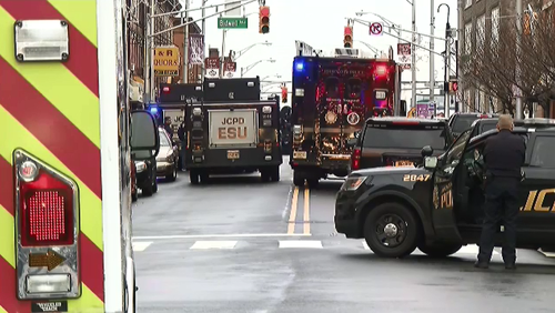 Two suspects have been shot by police after an armed hold up at a Jewish convenience store in New Jersey.