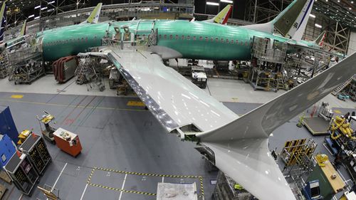 A Boeing 737 MAX 8 airplane sits on the assembly line in Boeing's 737 assembly facility in Renton, Washington.