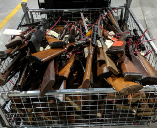 Police seized weapons including an assault rifle, shotguns, a machine gun, pistols, silencers, crossbows, a dagger, as well as "flash bang" explosives.
