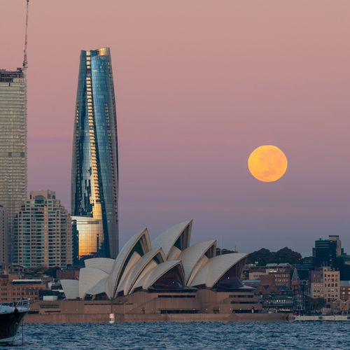 Sydney, Australia - May 6, 2023: Moonset view over Sydney Harbour.