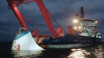 In this 1994 file photo, the bow door of the sunken passenger ferry M/S Estonia is lifted up from the bottom of the sea, off Uto Island, in the Baltic Sea, near Finland. 