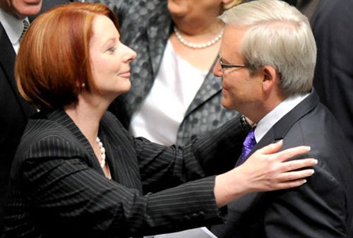 Julia Gillard greets Kevin Rudd in parliament.