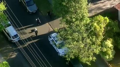 The allegedly armed man was arrested on Barcelona Street, Box Hill. (9NEWS)