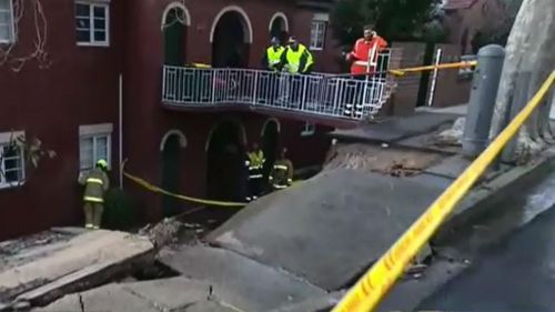 The sudden deluge caused a nearby brick wall to crumble, and local residents had to be evacuated. (9NEWS) 