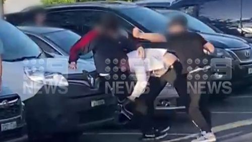 Police are investigating an alleged brawl between teenagers and a man in a business suit in a Sydney McDonald's car park.