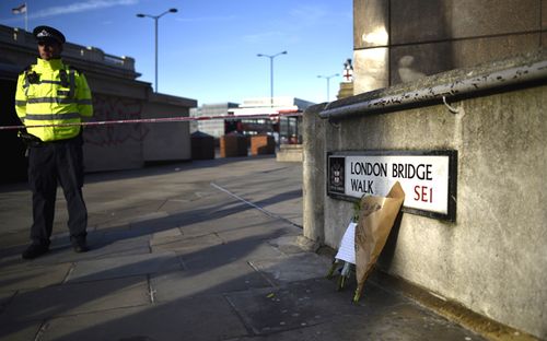 Flowers rest against a wall at the scene of the London Bridge stabbing attack. A man and a woman were killed and three seriously injured during the  stabbing attack. The suspect was shot dead by Police officers after members of the public restrained him.