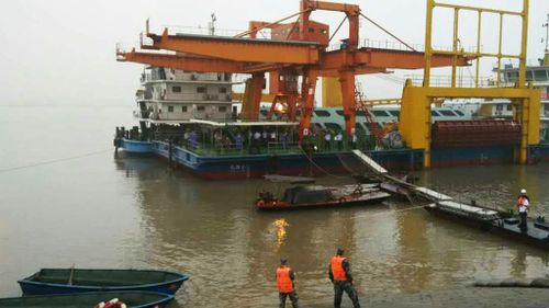 Cyclonic weather hampers rescue effort after ship carrying 458 people sinks in China's Yangtze River