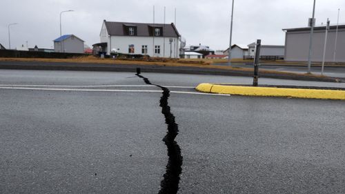 Cracks caused by volcanic activity emerge on a road in Grindavík, Iceland on November 11.