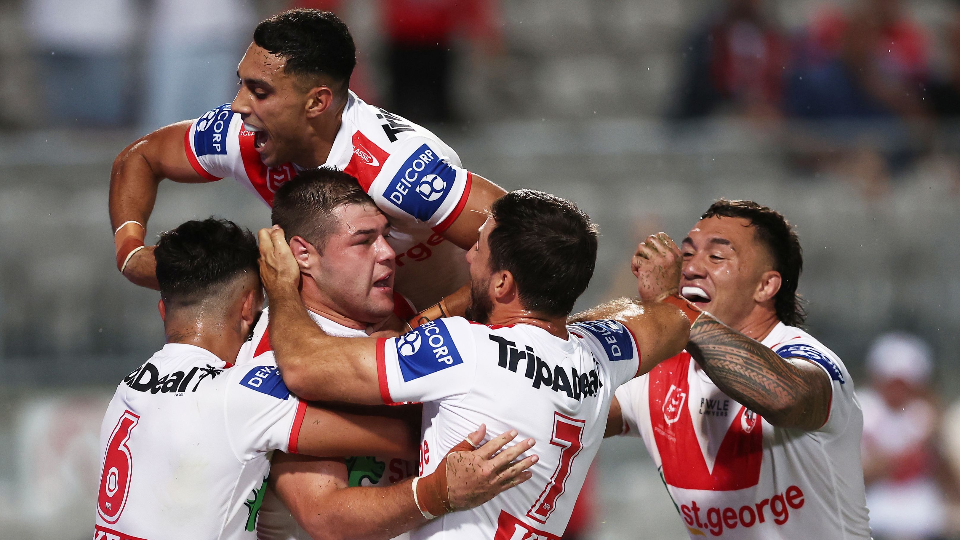 SYDNEY, AUSTRALIA - MARCH 12:  Blake Lawrie of the Dragons celebrates with team mates after scoring a try during the round two NRL match between the St George Illawarra Dragons and the Gold Coast Titans at Netstrata Jubilee Stadium on March 12, 2023 in Sydney, Australia. (Photo by Matt King/Getty Images)