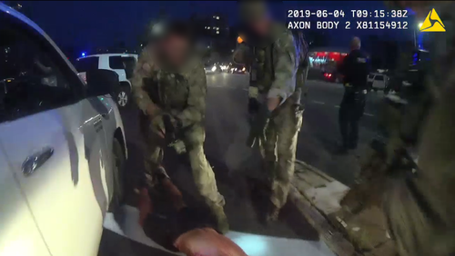 Benjamin Hoffmann tasered while being arrested on the Daly Street Bridge.