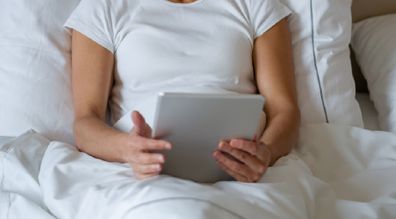 Woman in hotel bed