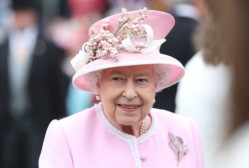 Queen Elizabeth II meets guests as she attends the Royal Garden Party at Buckingham Palace on May 29, 2019 in London, England 