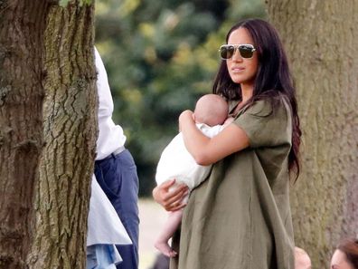 Meghan and Archie watch Prince Harry play the polo.