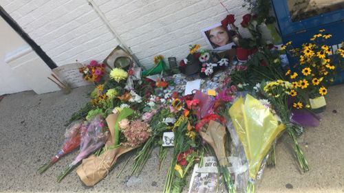 Men, women and children have paid tribute to Heather Heyer and others injured when a car ploughed into the crowd. (Lizzie Pearl)