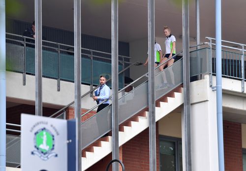 Officers have been at the Brisbane school through the morning. (AAP)