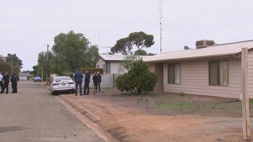 Investigators at the scene of a Crystal Brooke home where two police officers were stabbed.