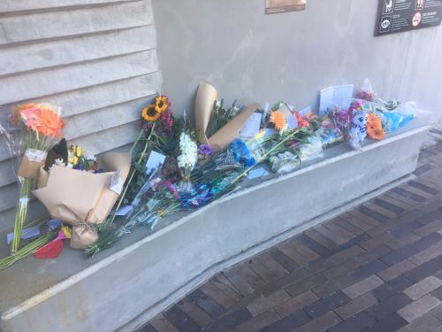 Community members have laid flowers at Oatley Train Station in memory of Alex. (9NEWS)
