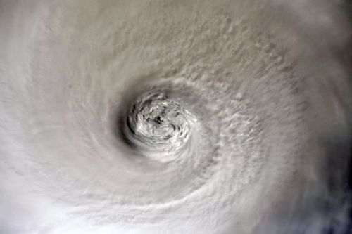 A handout photo made available by NASA shows an image of Hurricane Dorian's eye taken by NASA astronaut Christina Koch from aboard the International Space Station (ISS).